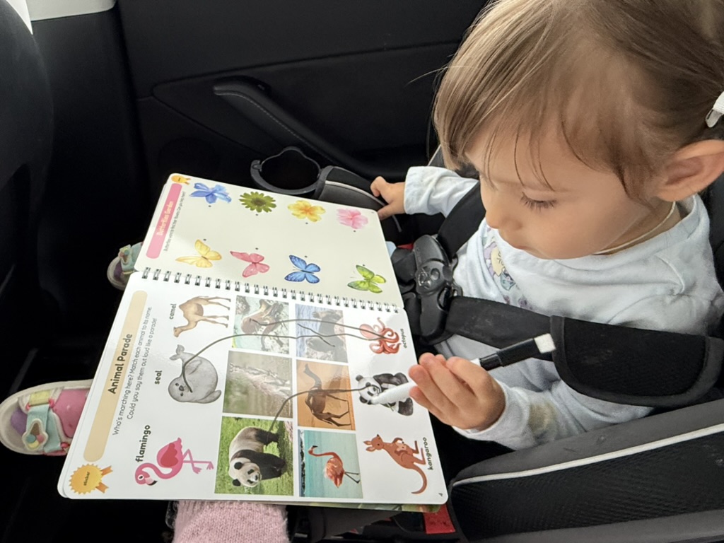 Toddler using the LAVnest Kids activity book